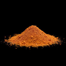 A heap of Aleppo pepper powder spilled on the ground, with nothing else in the image