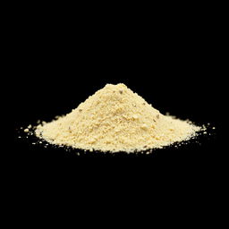 A mound of garlic powder neatly piled on a flat surface, with no other objects in the image
