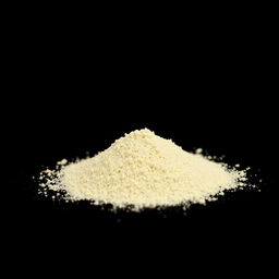 A mound of garlic powder neatly piled on a flat surface, with no other objects in the image