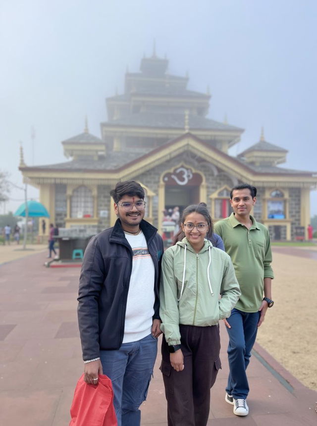 A colorful cartoon-style illustration of a couple standing in front of a beautiful temple shrouded in mist