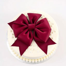 A beautifully decorated round white cake adorned with a large burgundy bow on top