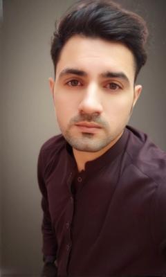 A stylish portrait of a confident young man, wearing a tailored dark shirt