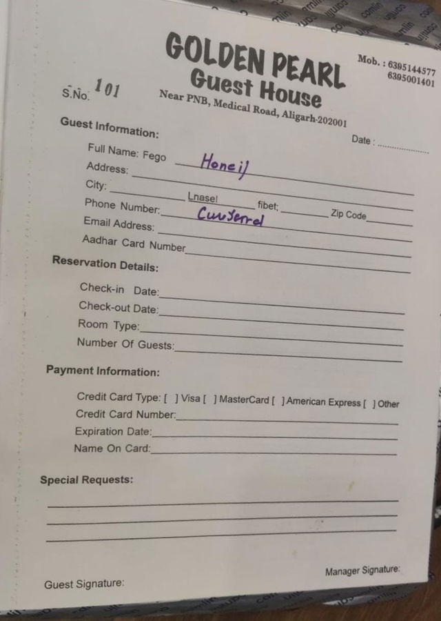 A blank guest registration form from a guest house, with typical fields such as guest information, reservation details, payment information, and a signature line