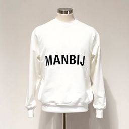 A modern men's white sweater featuring a striking print of the name 'MANBIJ' boldly displayed across the chest