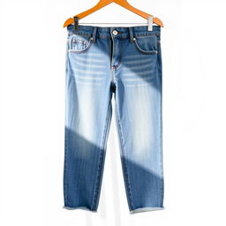 A stylish and fashionable pair of blue denim jeans with a vintage wash, featuring a high waist and a fitted silhouette