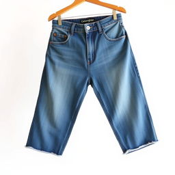 A stylish and fashionable pair of blue denim jeans with a vintage wash, featuring a high waist and a fitted silhouette