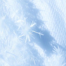A macro shot of light blue lint elevated against a textured white background, showcasing the microscopic fibers and intricate details of the lint