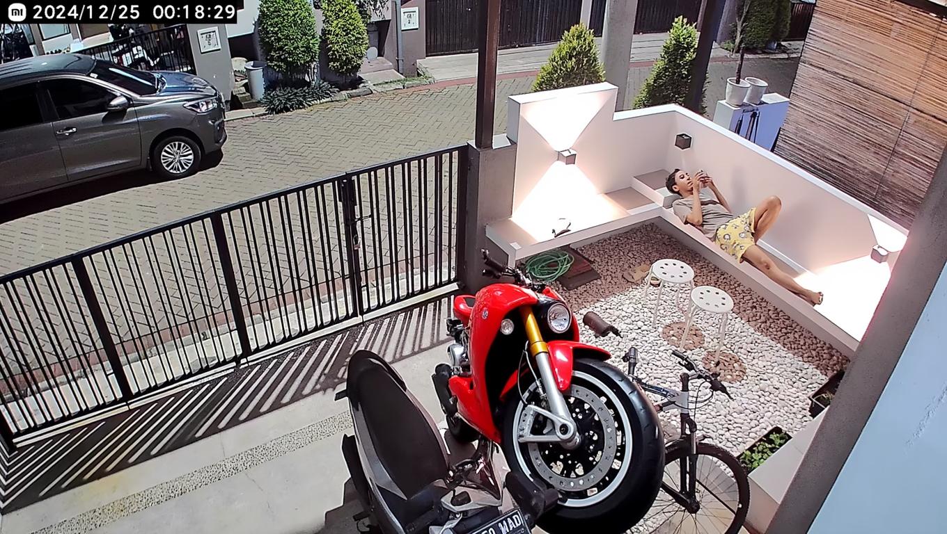 A modern, sleek Gsx 1000 motorcycle parked in a stylish driveway