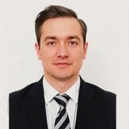 A professional passport size photo of a person without a beard, wearing a smart court tie