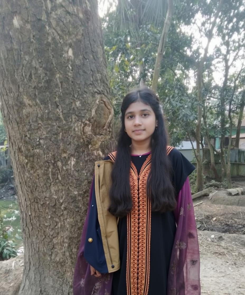 A serene outdoor portrait featuring a young woman standing gracefully by a large tree