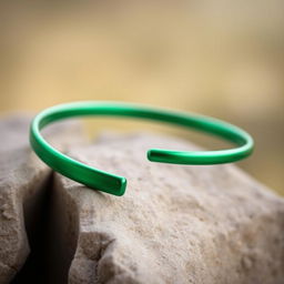A simple yet elegant green metal bracelet, featuring a minimalist design with a smooth and shiny surface