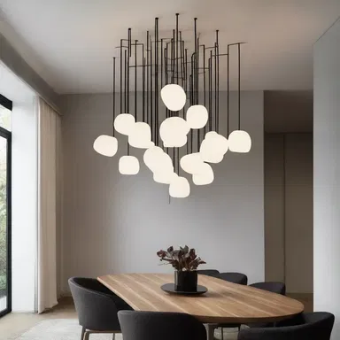 The designer created a unique lighting fixture inspired by the concept of abacinating, to create a dramatic effect in the space.