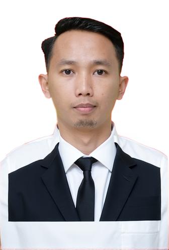 A young man wearing a tailored suit composed of a crisp white shirt and a sleek black tie