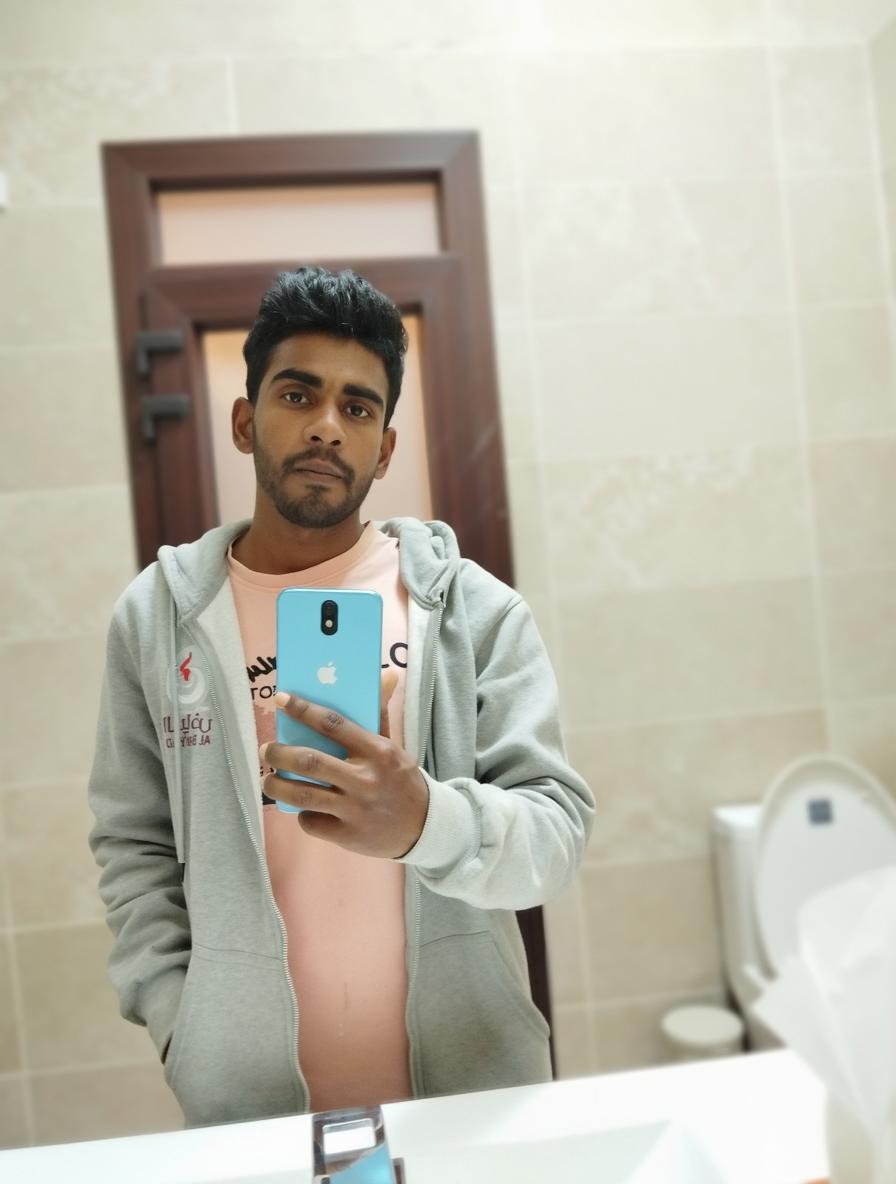 A high-quality, detailed image of a young man taking a selfie in a modern bathroom