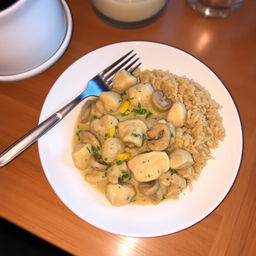 A delicious plate of Chicken Stroganoff served beside a generous helping of brown rice