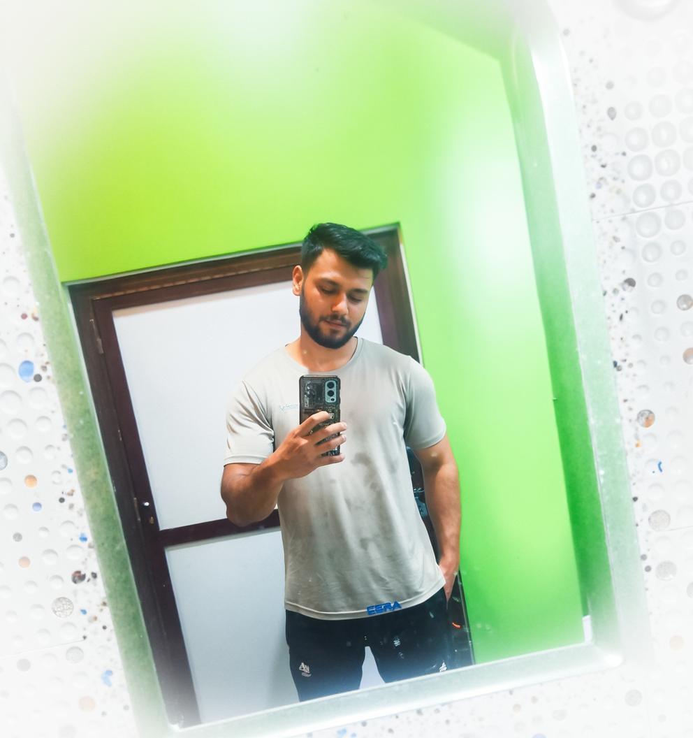 A dynamic and captivating scene of a mirror reflecting a young man taking a selfie