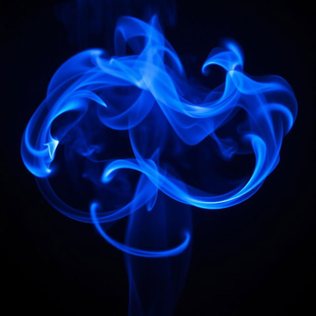 A mesmerizing visual of swirling blue flames, casting a mystical glow in a dark environment