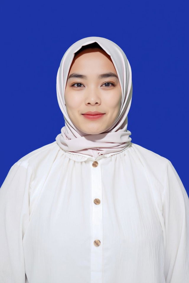 A portrait of a woman wearing a black hijab, smiling softly