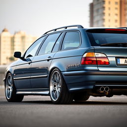 A BMW E39 Touring with a sleek, lowered roofline, showcasing its stylish BBS split rims