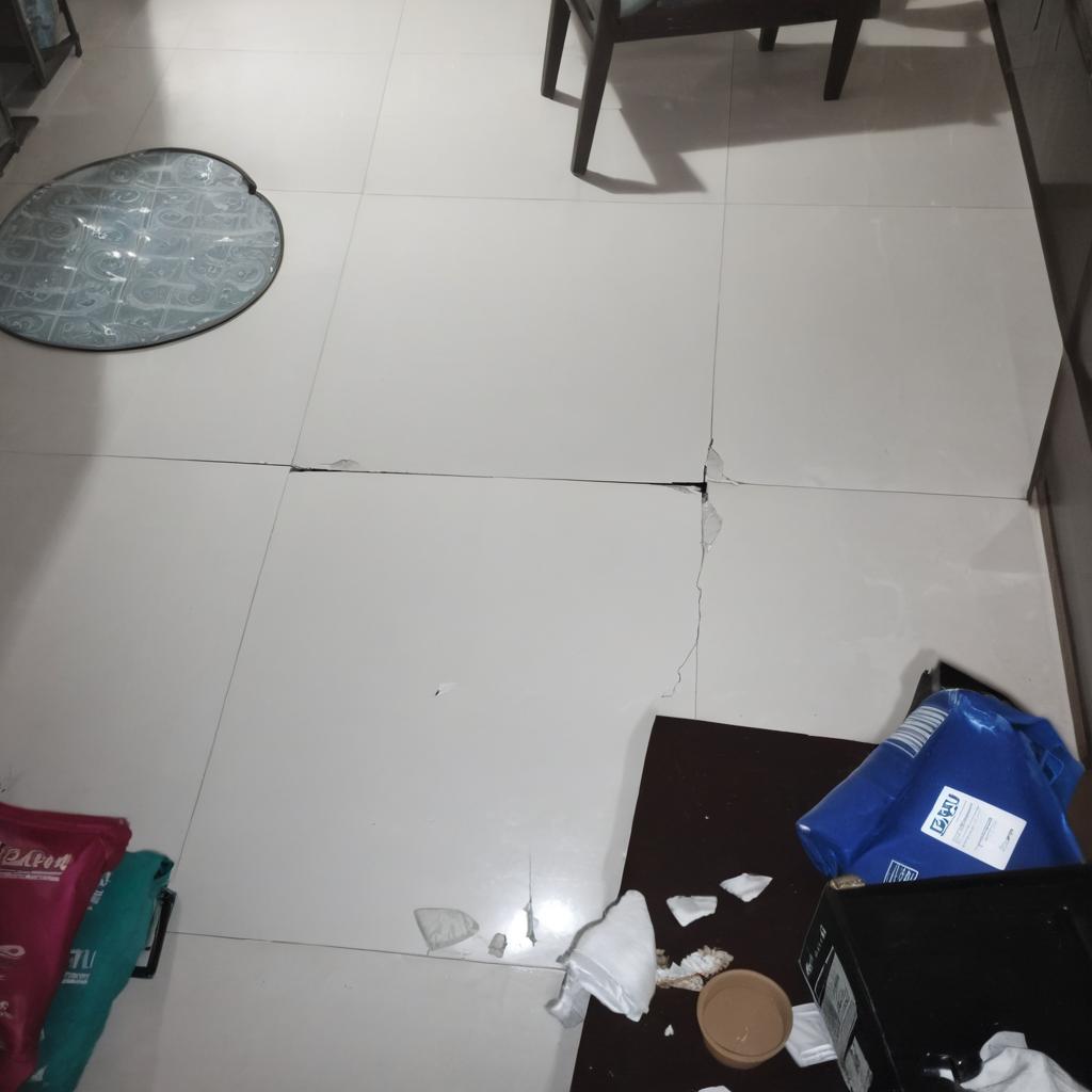 Broken cielling debri on the tile