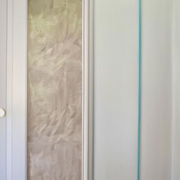 A large 8 by 8 sliding wardrobe in textured shades of white, enhanced with colorful lavish prints.