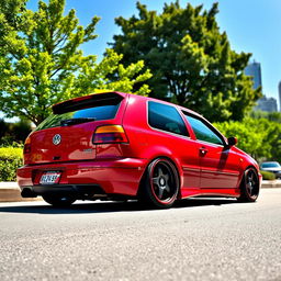 A 1998 Volkswagen Golf GTI, modified with a lowered suspension and stylish deep-dish wheels, showcasing its sporty and aggressive stance