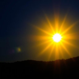 A vivid scene featuring a radiant sun shining brightly in a clear blue sky, illuminating the landscape with intense yellow and gold hues