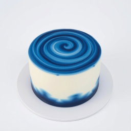 A beautifully crafted cake featuring a stunning dark blue and white color combination