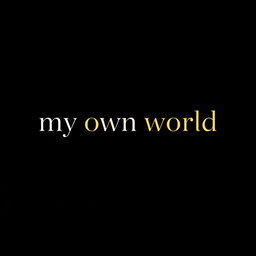A minimalist design featuring a striking black background with the words "my own world" elegantly centered in a bold, modern font