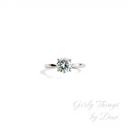 A stunning solitaire diamond ring placed against a clean white background, minimalist and chic design