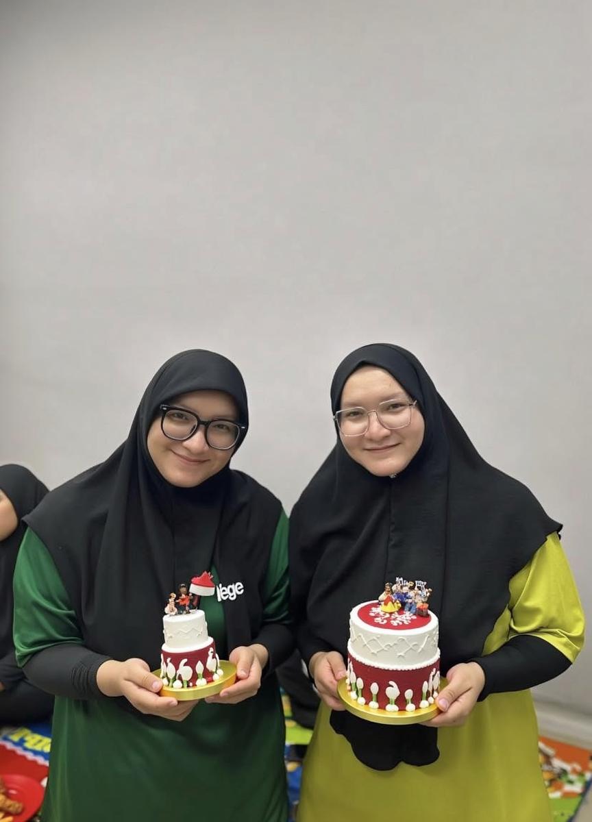 Two Muslim women in colorful hijabs, smiling and standing close together, displaying a joyous expression