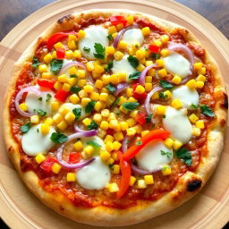 An appetizing pizza adorned with a bright mix of sweet corn, crunchy onions, and vibrant capsicum, showcasing a colorful palette of toppings