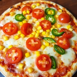 A scrumptious pizza topped with sweet corn and juicy tomatoes, perfectly complemented by fresh green capsicum