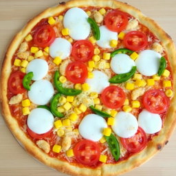 An appetizing pizza adorned with sweet corn and juicy tomatoes, elegantly paired with fresh green capsicum