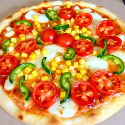 A scrumptious pizza featuring sweet corn and juicy, ripe tomatoes, perfectly paired with fresh green capsicum slices