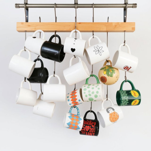 A vertical design featuring Instagrammable hanging mugs, showcasing a modern and industrial aesthetic