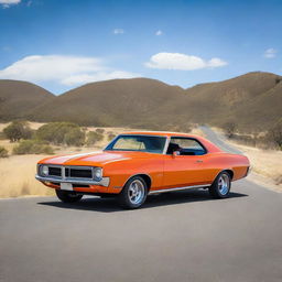 An orange HQ Monaro equipped with a tunnel ram intake system, parked on a wide road with a blue sky in the backdrop