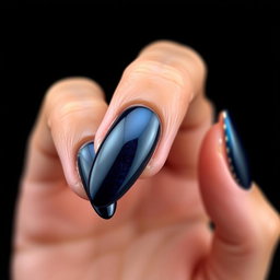 A stunning beauty shot of an almond-shaped nail design, featuring smooth edges and a striking black background