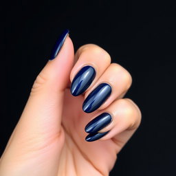 A captivating beauty shot of an almond-shaped nail design featuring meticulously defined edges and set against a striking sky black background
