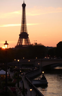 An evening scene of the Eiffel Tower bathed in warm golden light during sunset