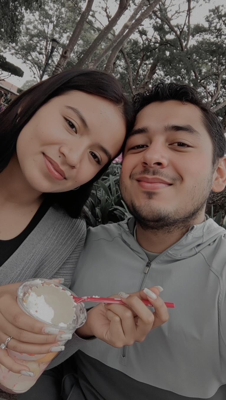 A cozy and cheerful scene depicting a young couple enjoying ice cream together in a park