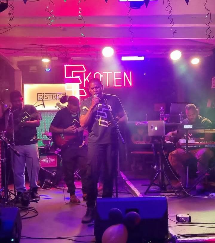 A lively concert scene showcasing a vibrant performance on stage