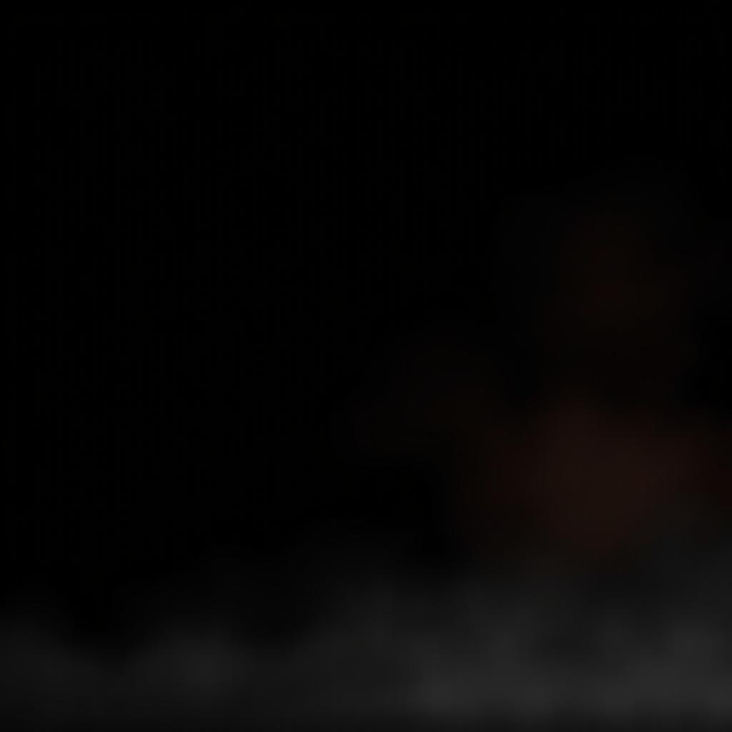 A somber and atmospheric scene with a black background subtly enhanced with touches of orange light