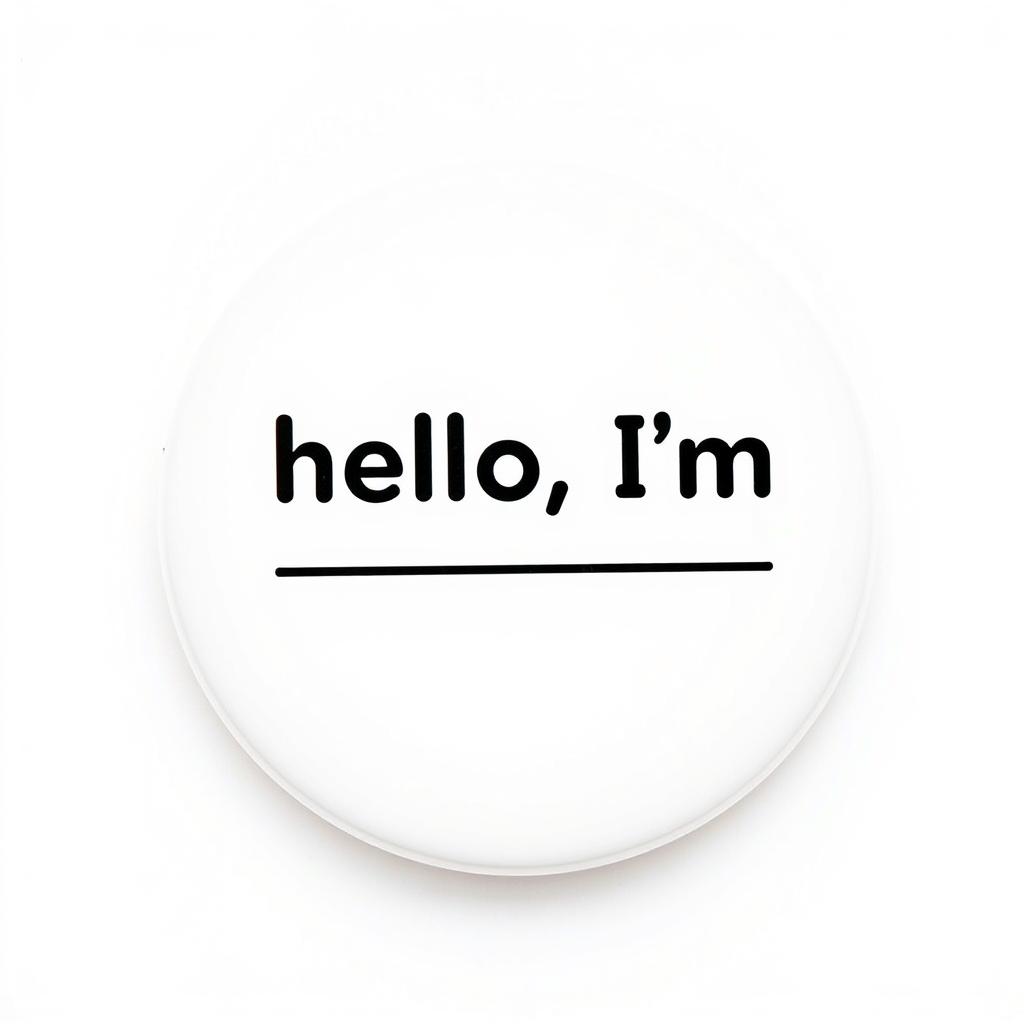 A circular white button pin design featuring the text "hello, I'm _______" in a playful and modern font
