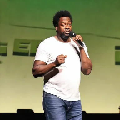 The comedian walked anteriorly on stage, ready to deliver their punchline.