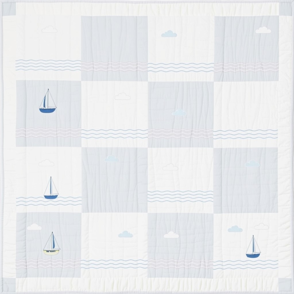 A simple and serene patchwork quilt design featuring a marina theme