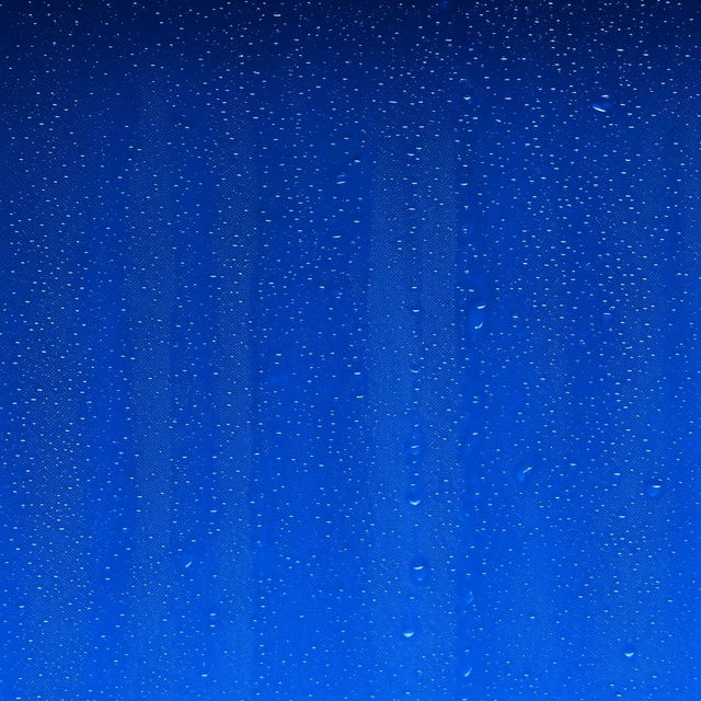 Glistening mineral water droplets cascading down a deep blue background in a 16:9 aspect ratio.