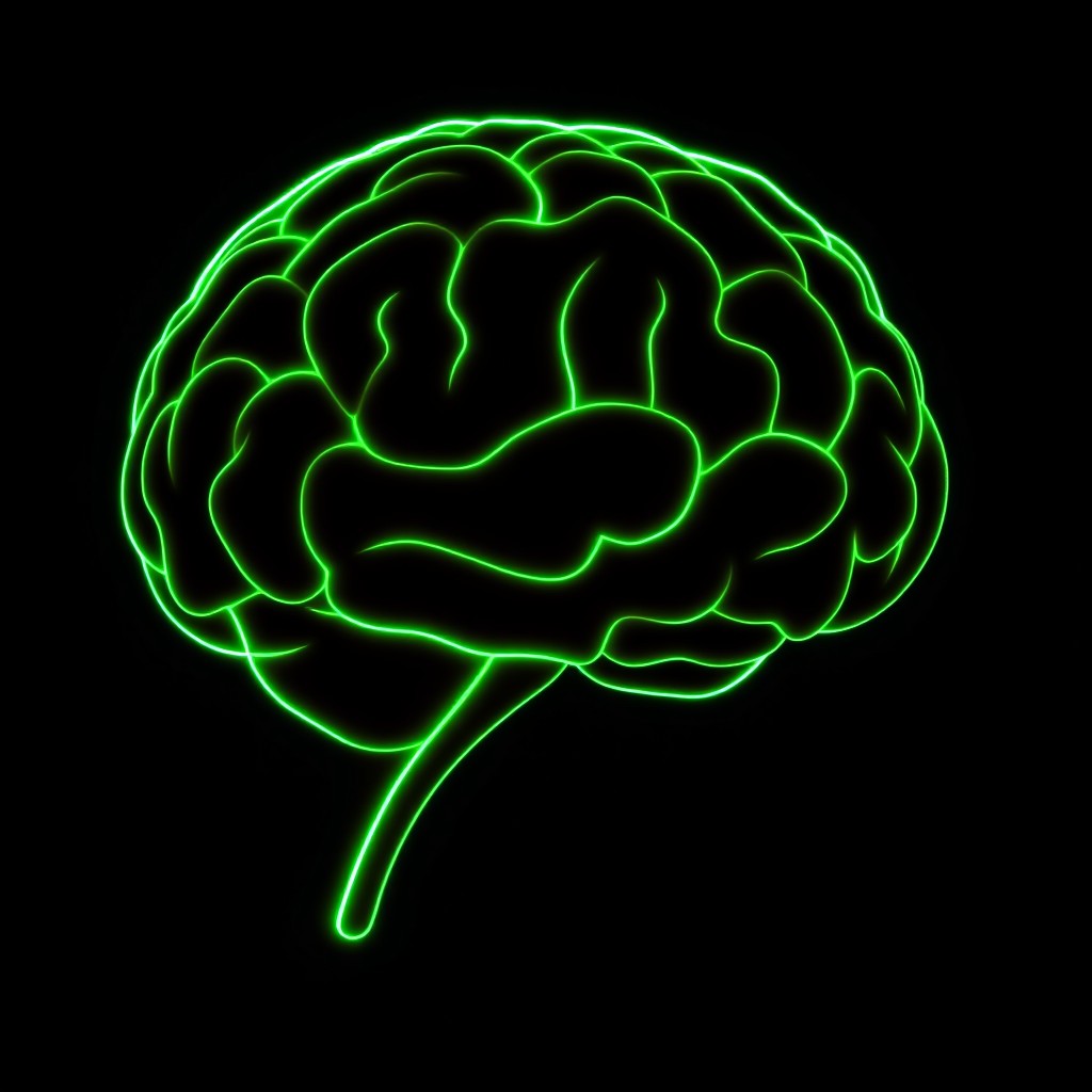 A striking silhouette of a human brain created with vibrant green neon light, set against a deep, dark background
