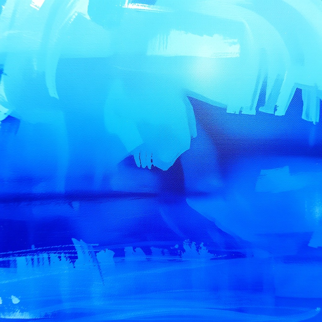 An artistic representation of a vibrant blue color dominating the canvas
