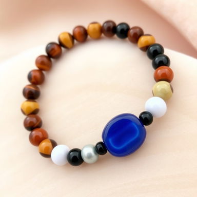 A beautifully crafted bracelet featuring a combination of 8mm beads made from tiger's eye, hematite, carnelian, white quartz, and black obsidian, perfectly alternating in a vibrant pattern